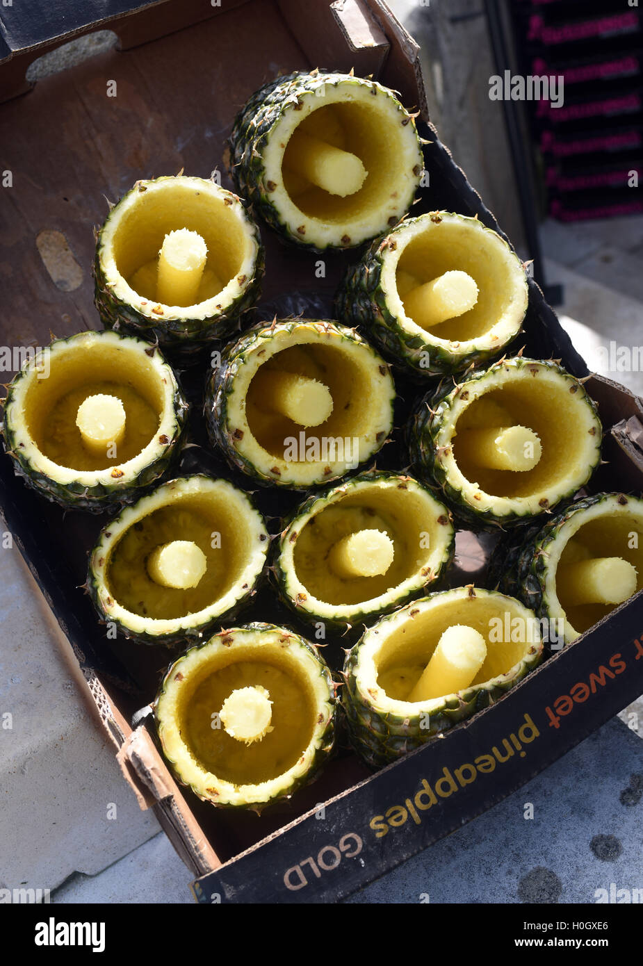 Pineapple skins cored flesh cut out market Stock Photo Alamy