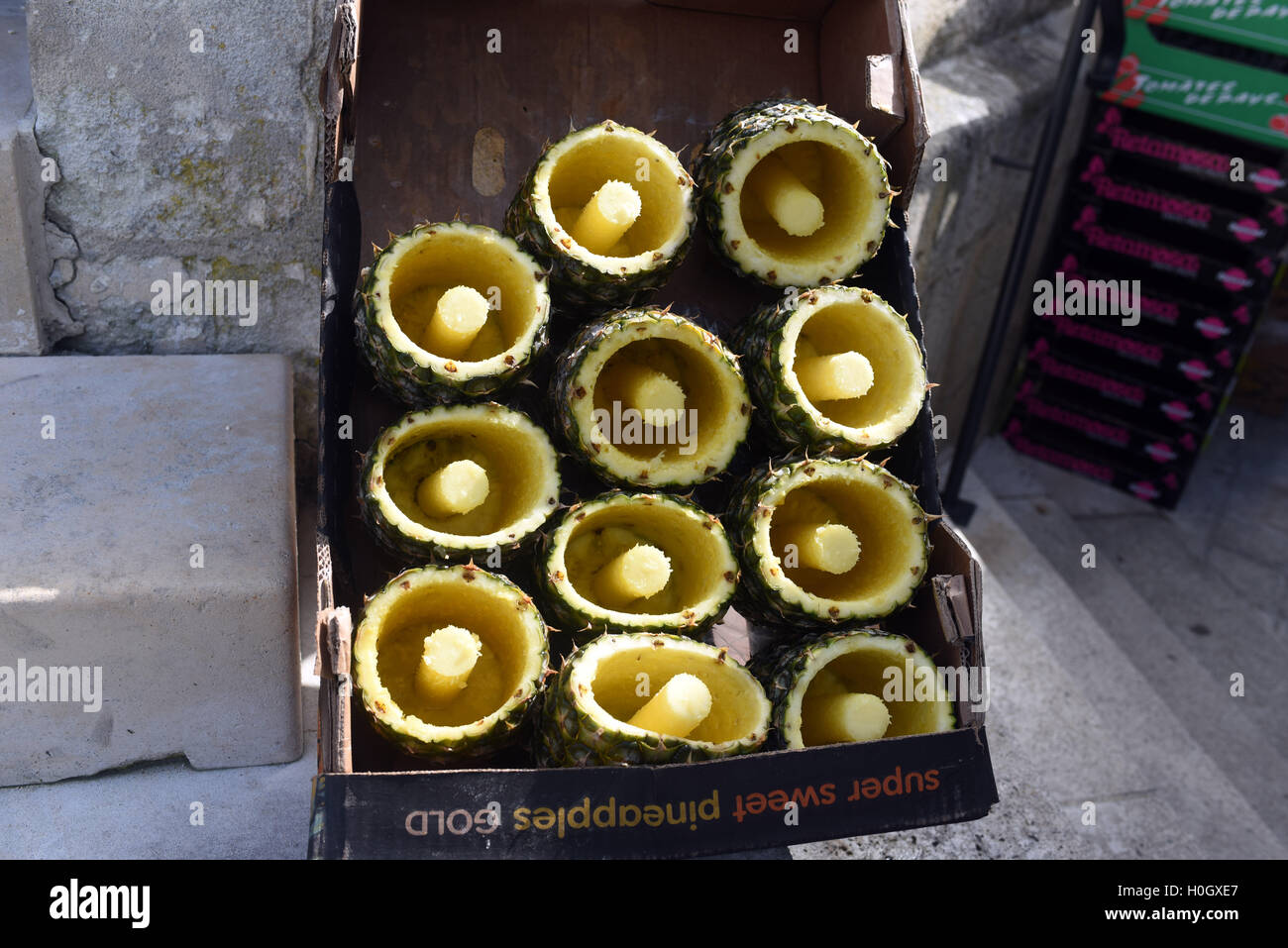 Pineapple skins cored flesh cut out market Stock Photo Alamy