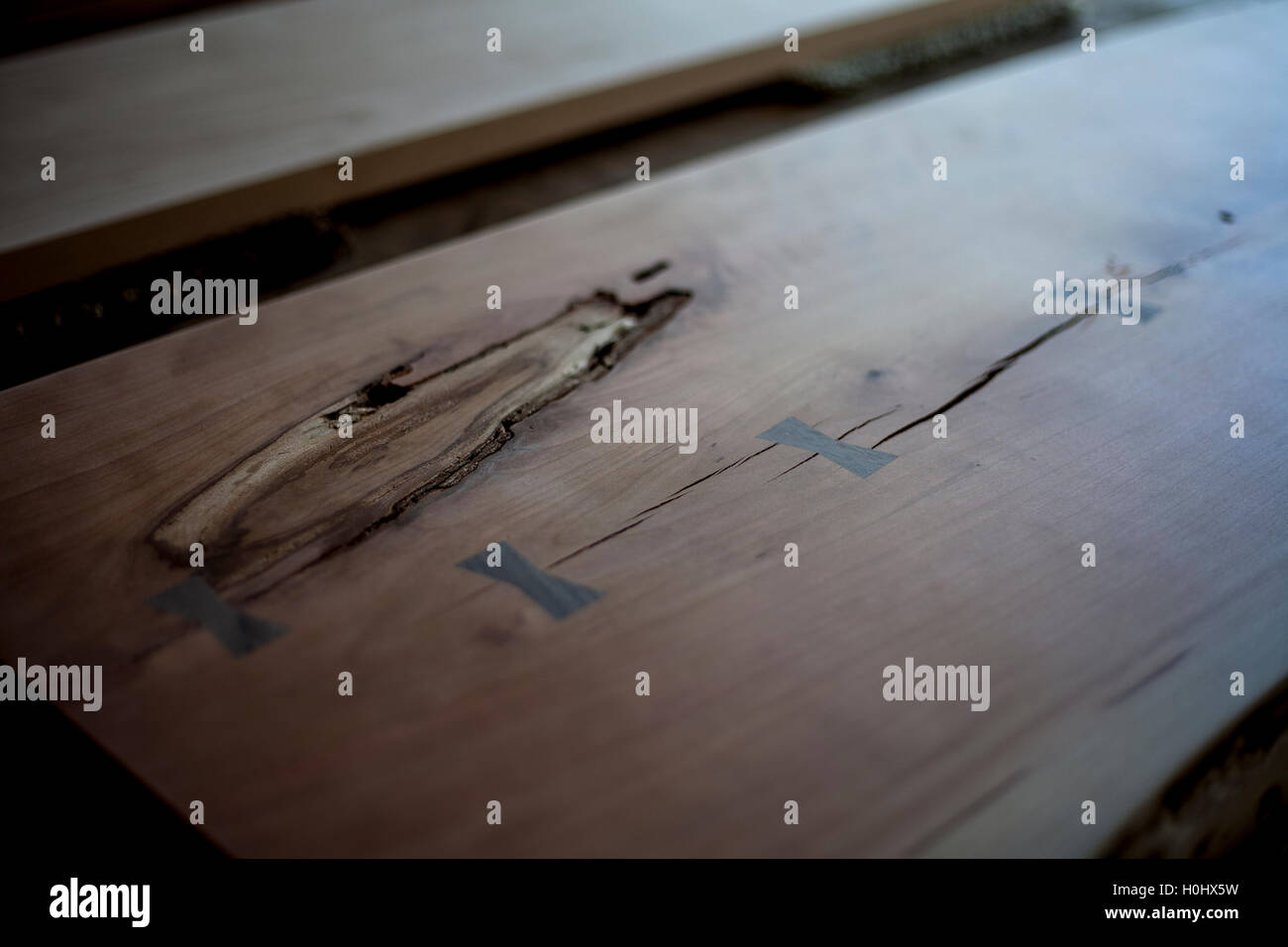 Custom wood table top awaiting stain and assembly Stock Photo - Alamy
