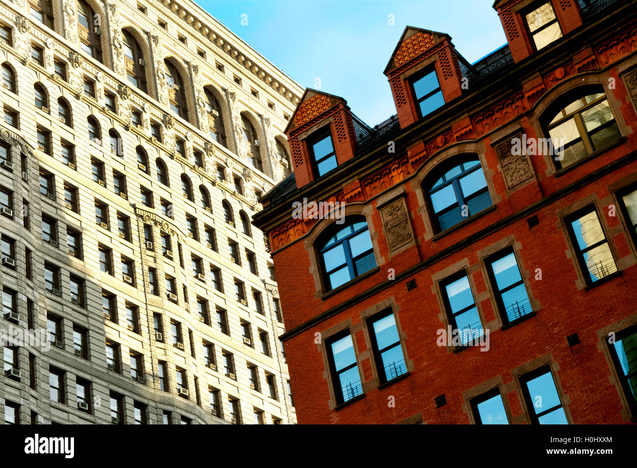 Dramatic Angled Front Facade of Flatiron Building in Manhattan with Terra Cotta Building, New York City, NY, USA Stock Photo