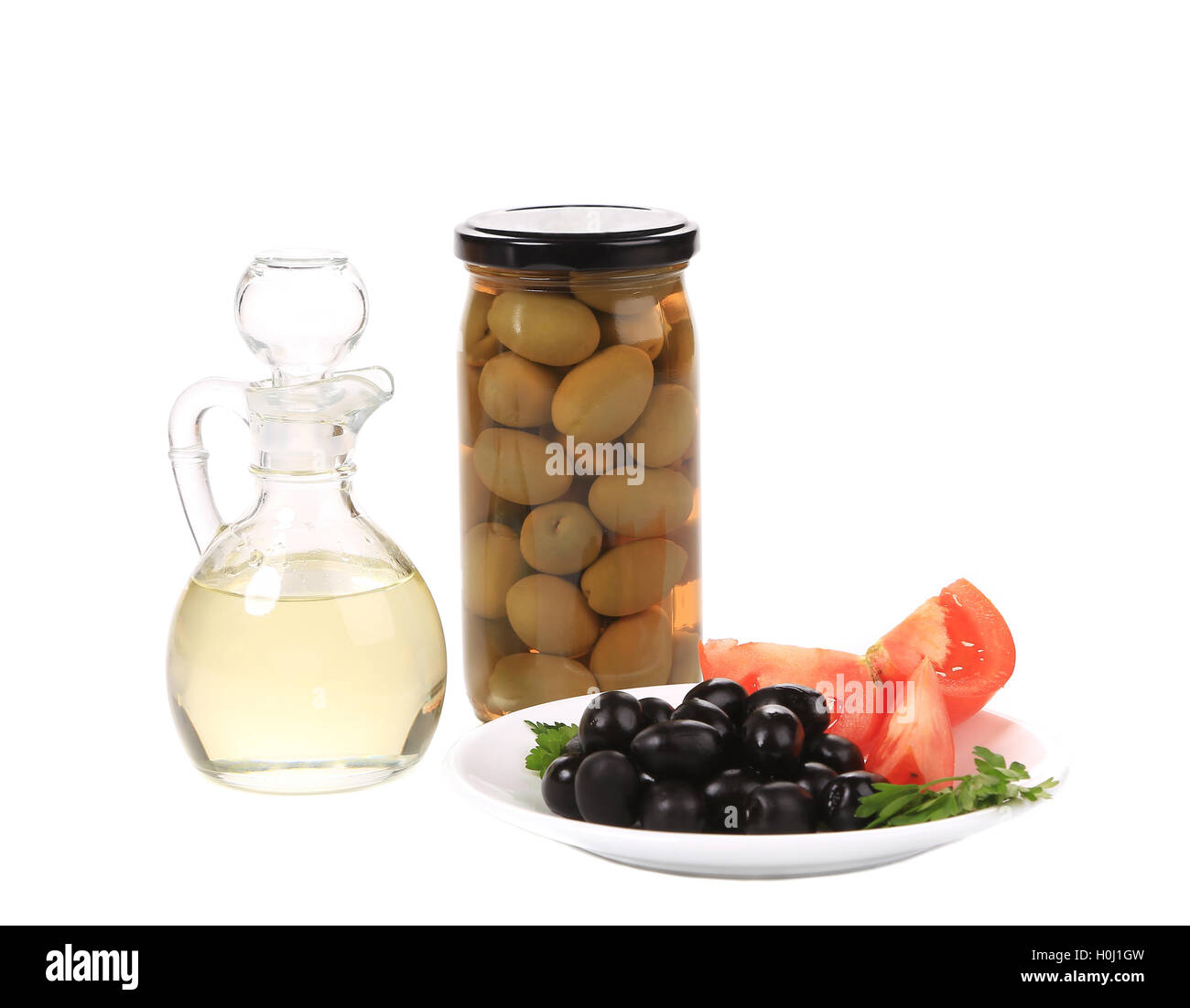 Bottle and bowl of olives with vinegar Stock Photo Alamy