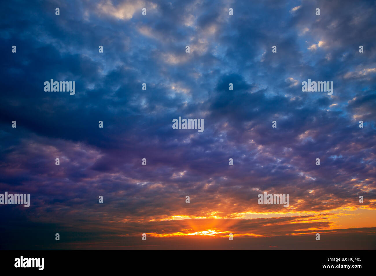 Dramatic sky with stormy clouds in sunset Stock Photo - Alamy