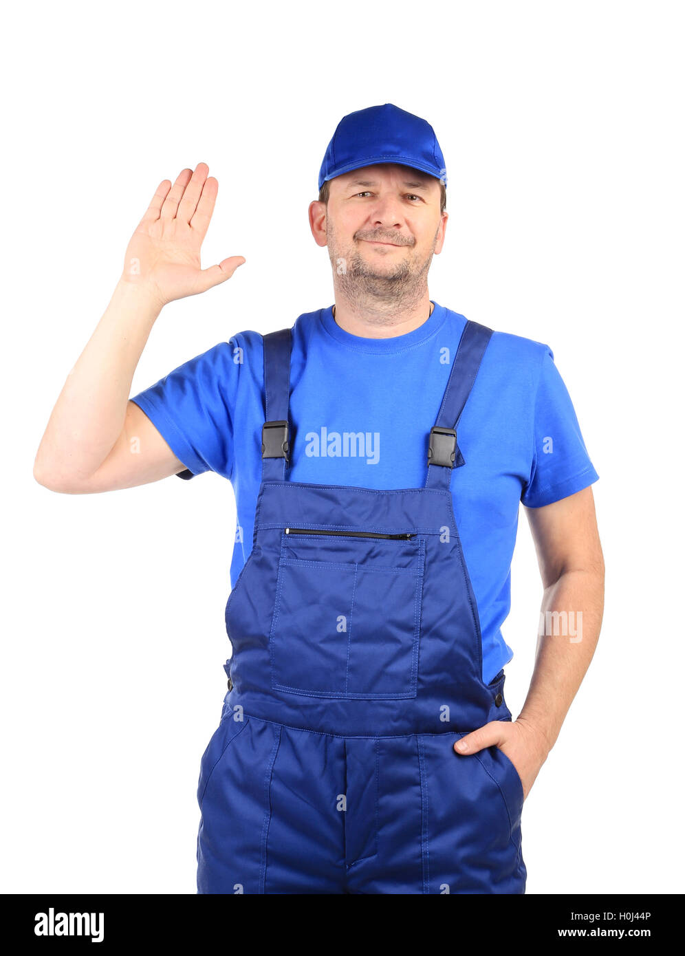 Worker in blue overalls Stock Photo - Alamy