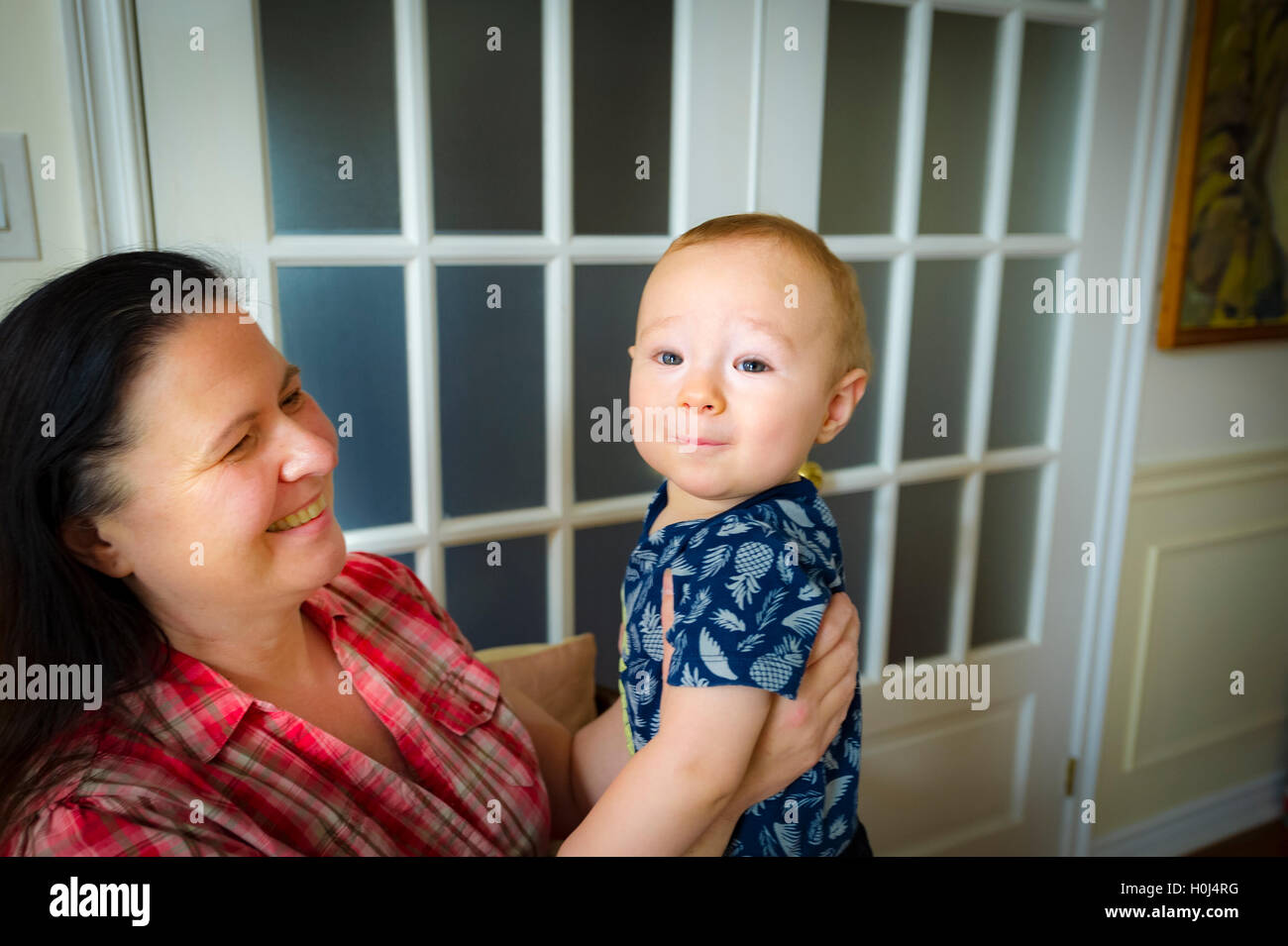 Woman playing with 9 months old grandson Stock Photo