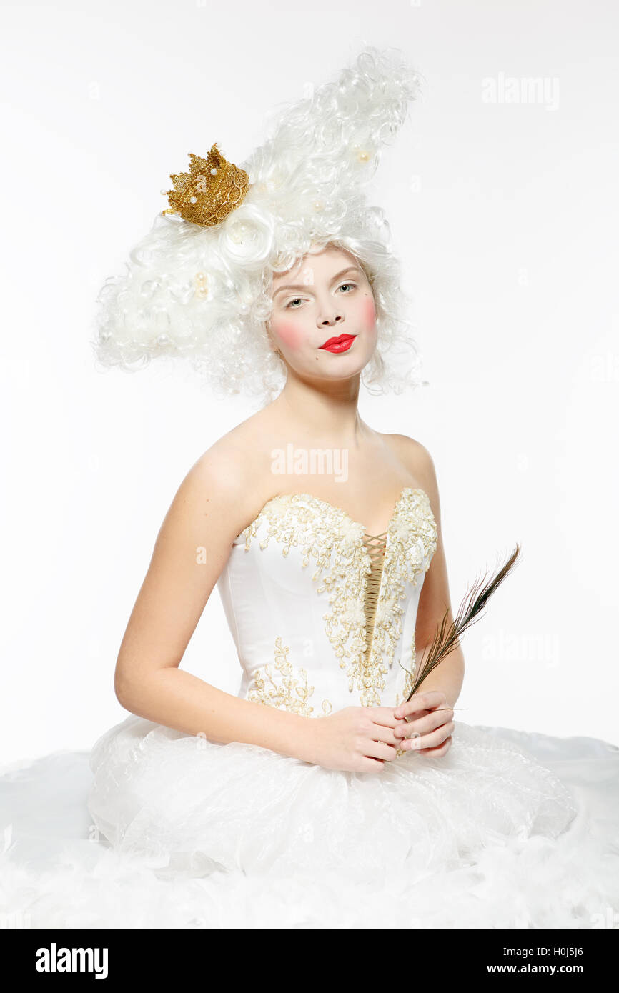 Princess with a golden crown in a white dress Stock Photo - Alamy