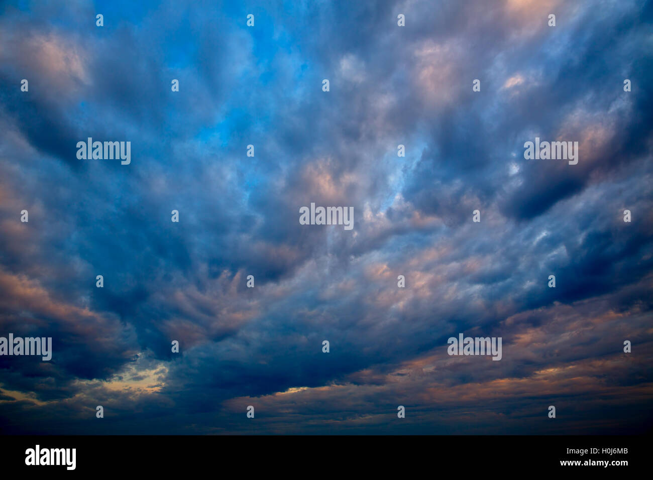 Dramatic sky with stormy clouds in sunset Stock Photo - Alamy