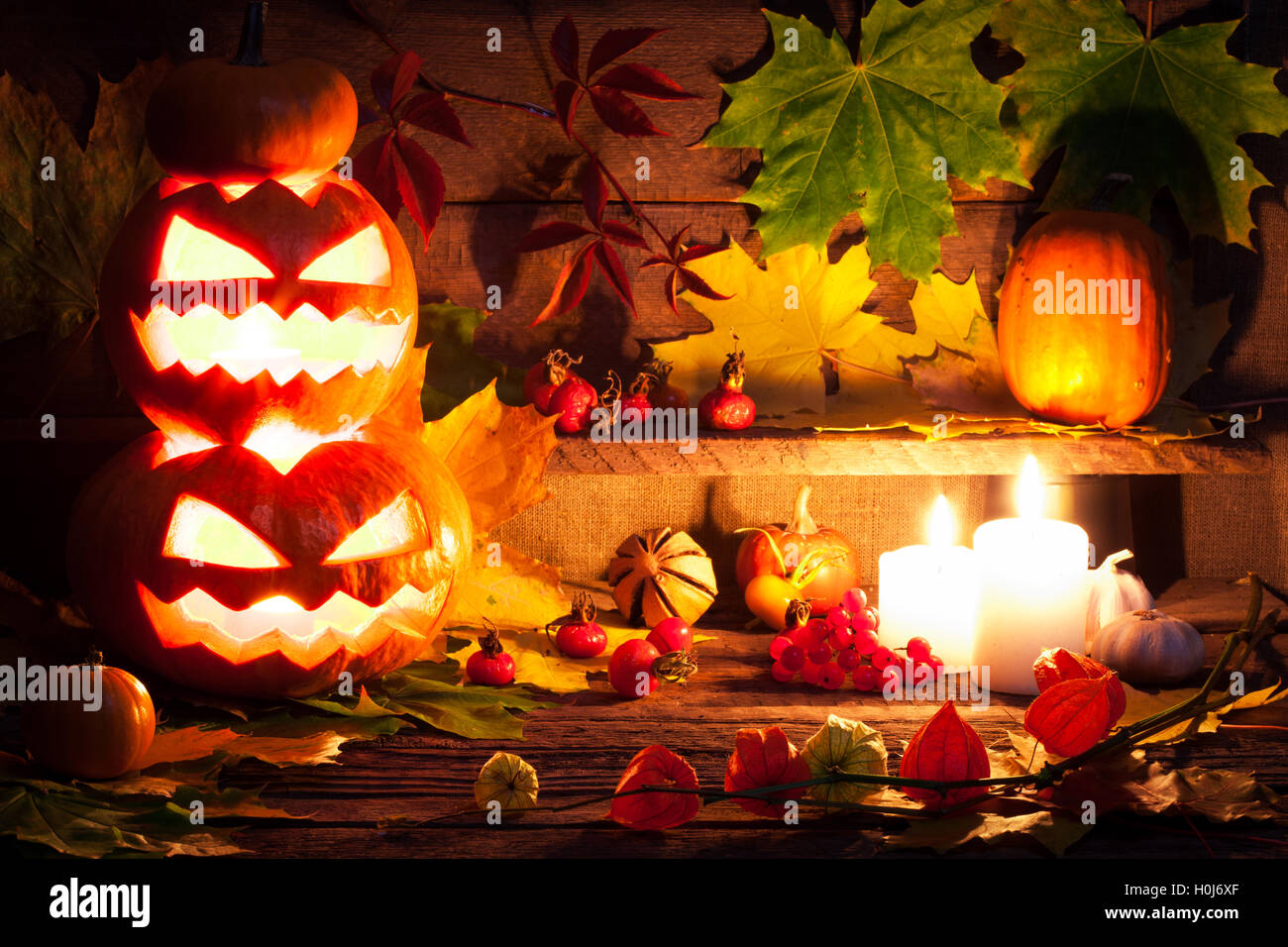 Halloween pumpkin head jack lantern with burning candles Stock Photo ...