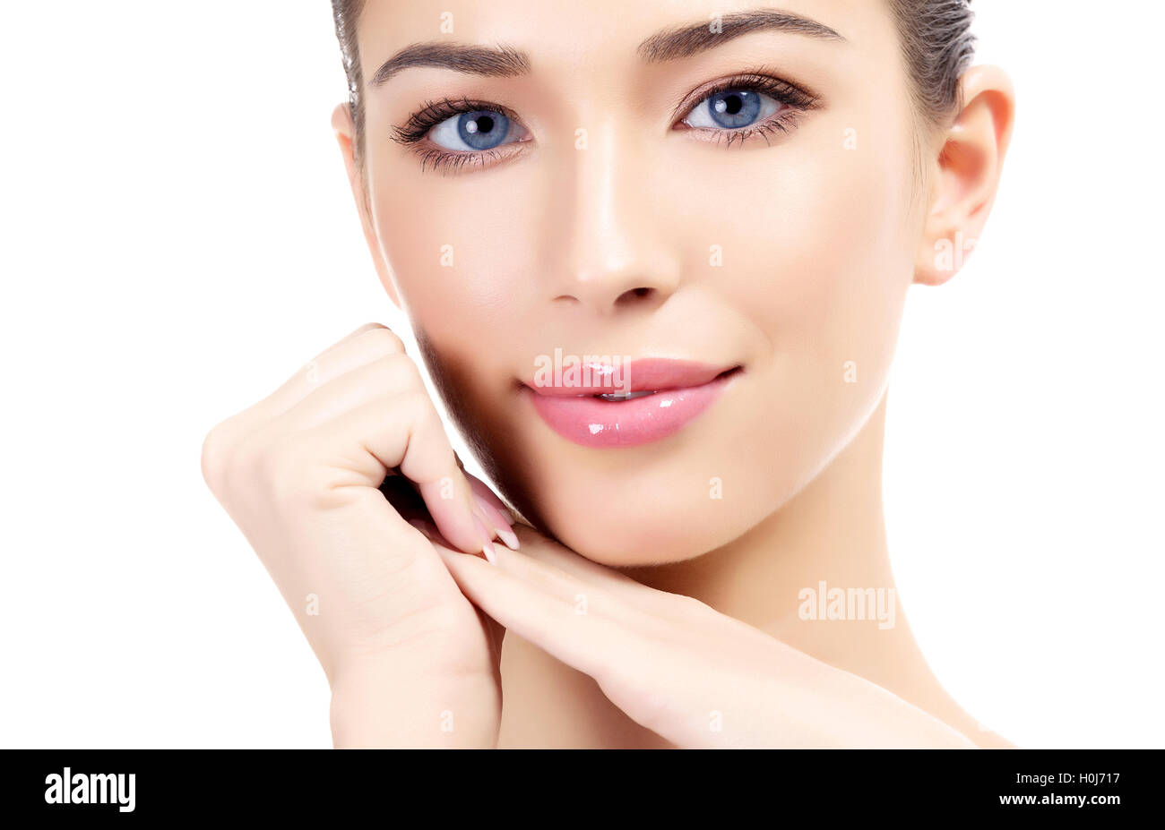 Beautiful girl with clean fresh skin, white background Stock Photo
