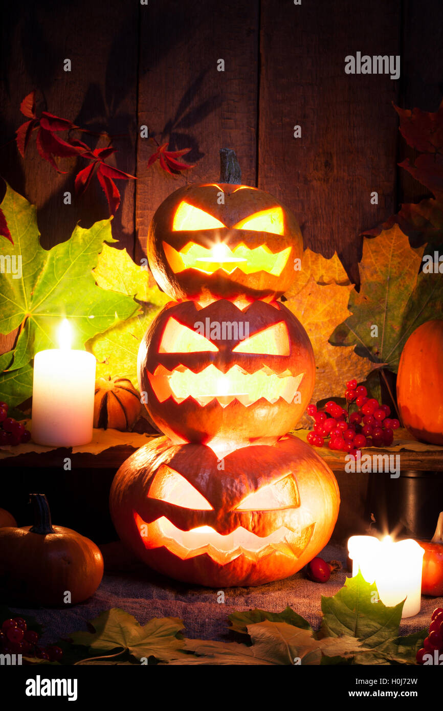 Halloween pumpkin head jack lantern with burning candles Stock Photo ...