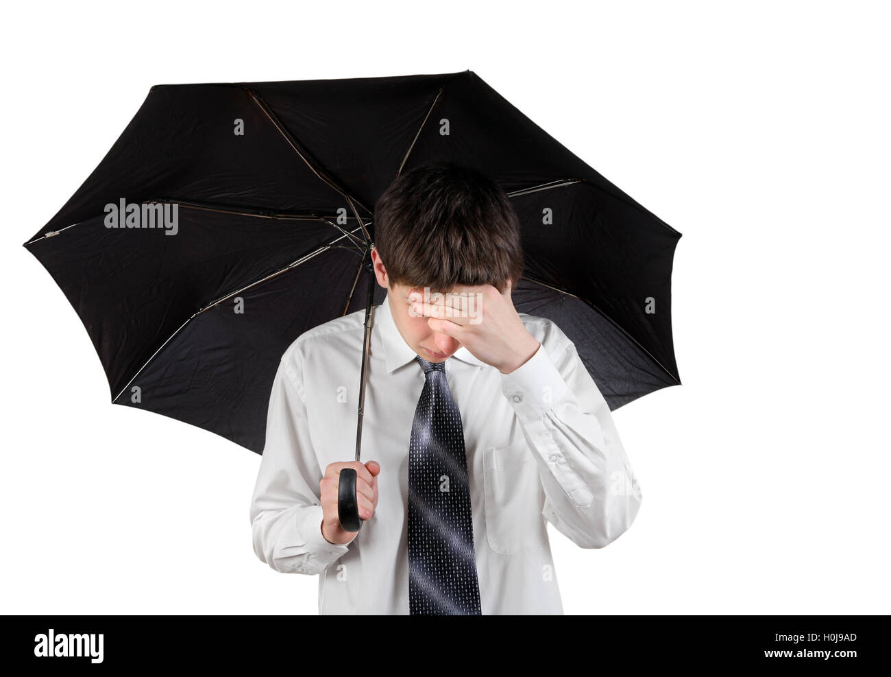 Sad Man with Umbrella Stock Photo