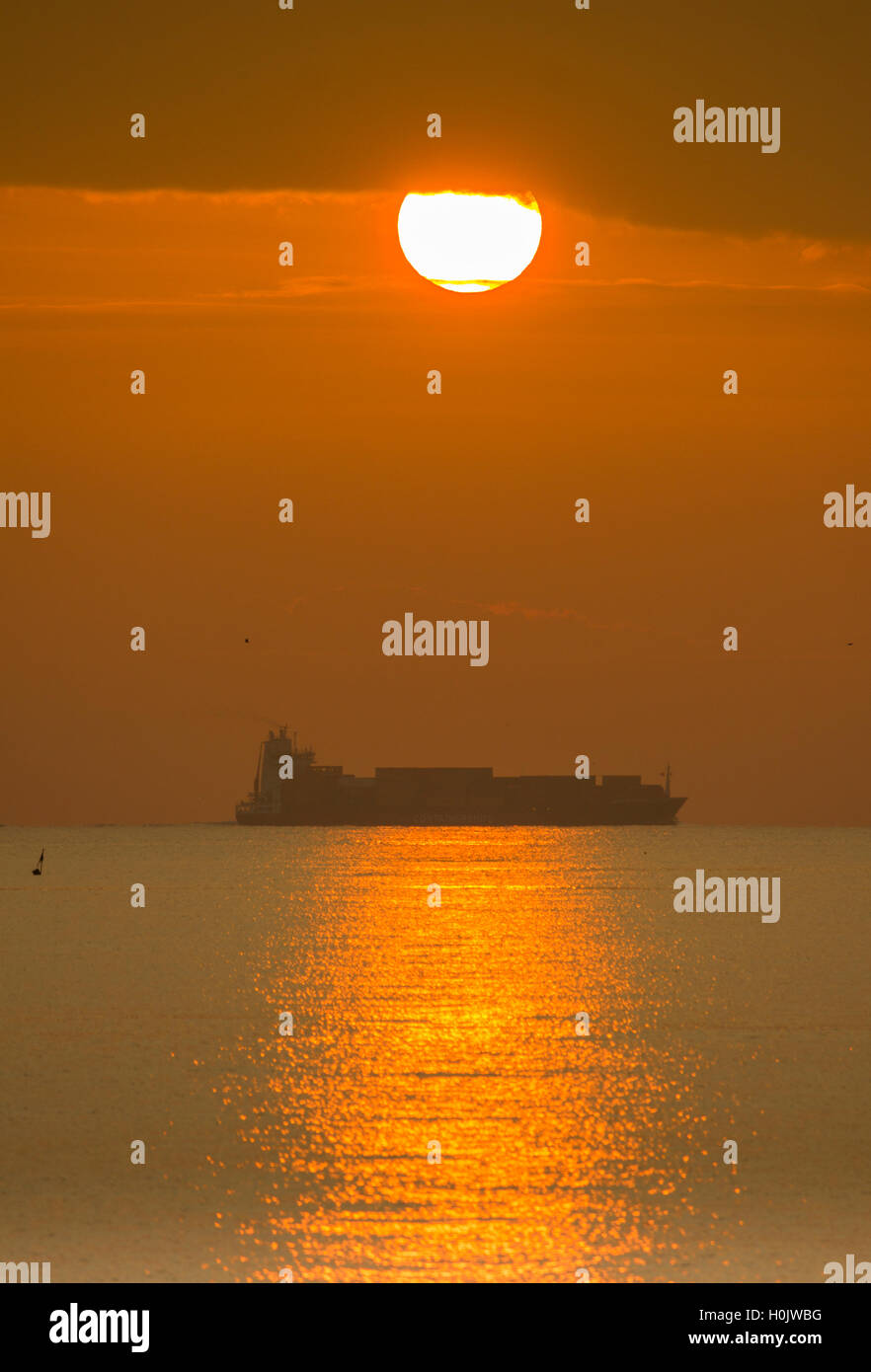 Seaton Carew, north east England, UK. 21st September, 2016. Weather: Ship at sunrise at Seaton Carew on the north east coast as the sun rises over the North sea, the last sunrise before the Autumnal Equinox (22nd September). Credit:  Alan Dawson News/Alamy Live News Stock Photo