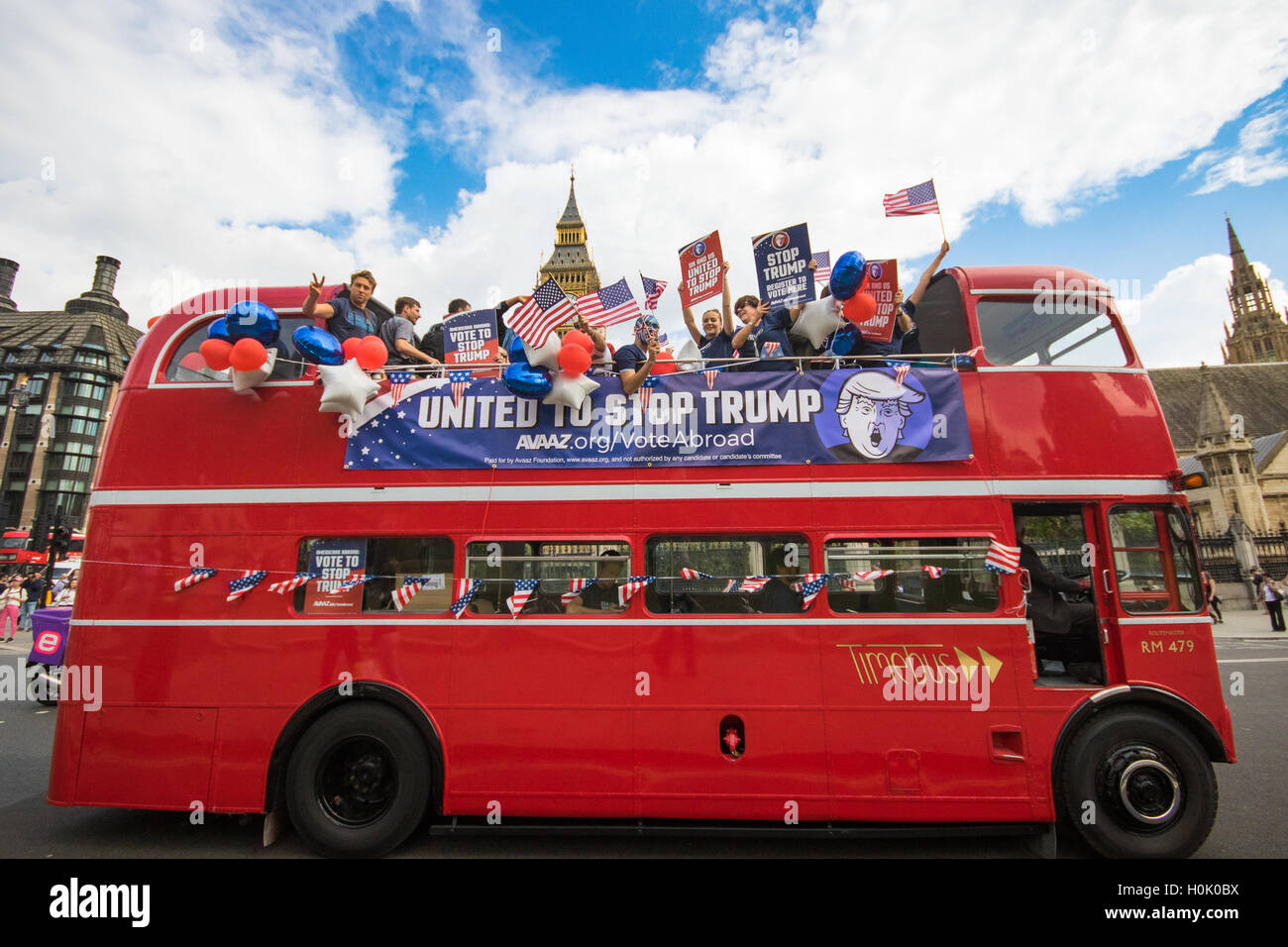 London, UK. 21st Sep, 2016. London, September 21st 2016. A "Stop Trump" open topped red London double-decker bus passes the Houses of Parliament and Big Ben in London in a bid to encourage US expats to register to vote in the Presidential election, expecting the majority of them to be more inclined to support Hilary Clinton. Credit:  Paul Davey/Alamy Live News Stock Photo