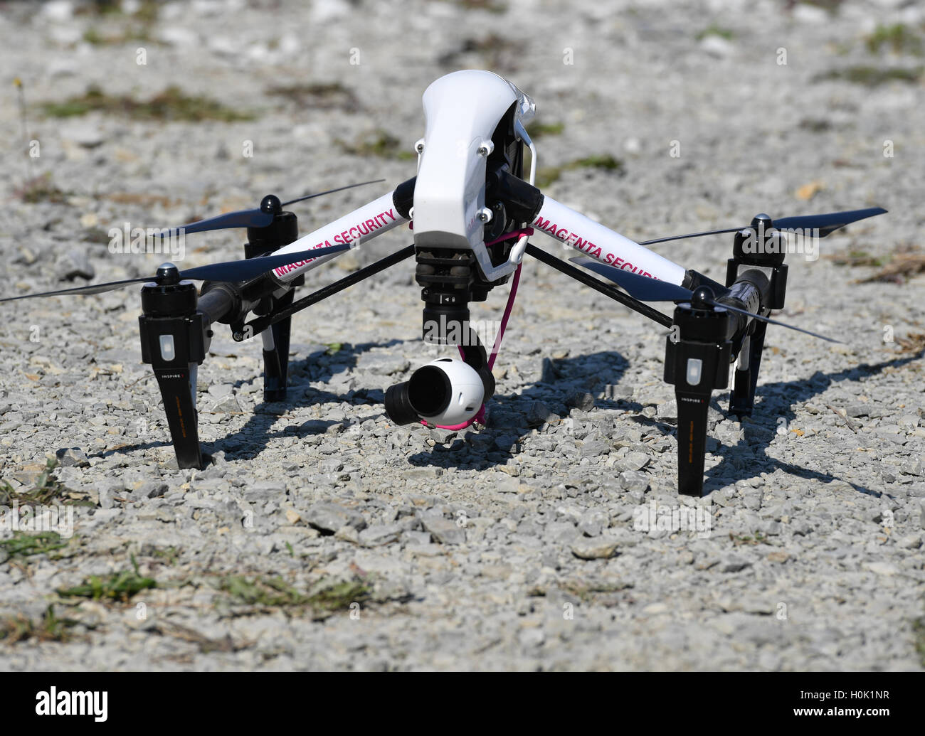 Biere, Germany. 12th Sep, 2016. A drone of Telekom with the inscription 'Magneta Telekom' can be seen the grounds at the laying of the first stone for the expansion of the Cloud-Rechenzentrum of Deutsche Telekom in Biere, Germany, 12 September 2016. Photo: Jens Kalaene/dpa/Alamy Live News Stock Photo