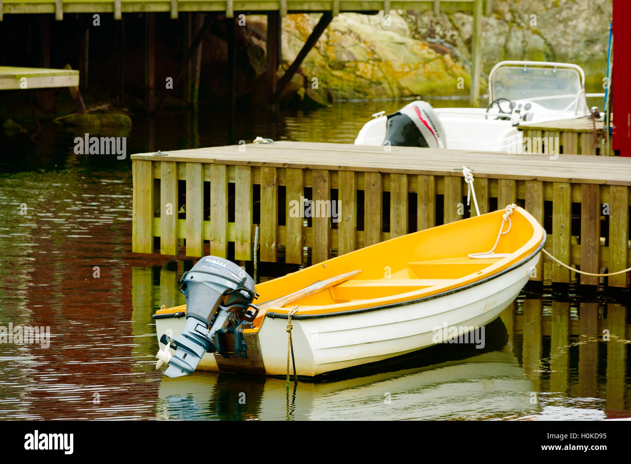 Tjorn, Sweden - September 9, 2016: Environmental documentary of a small open motorboat or rowboat with a Yamaha motor attached. Stock Photo