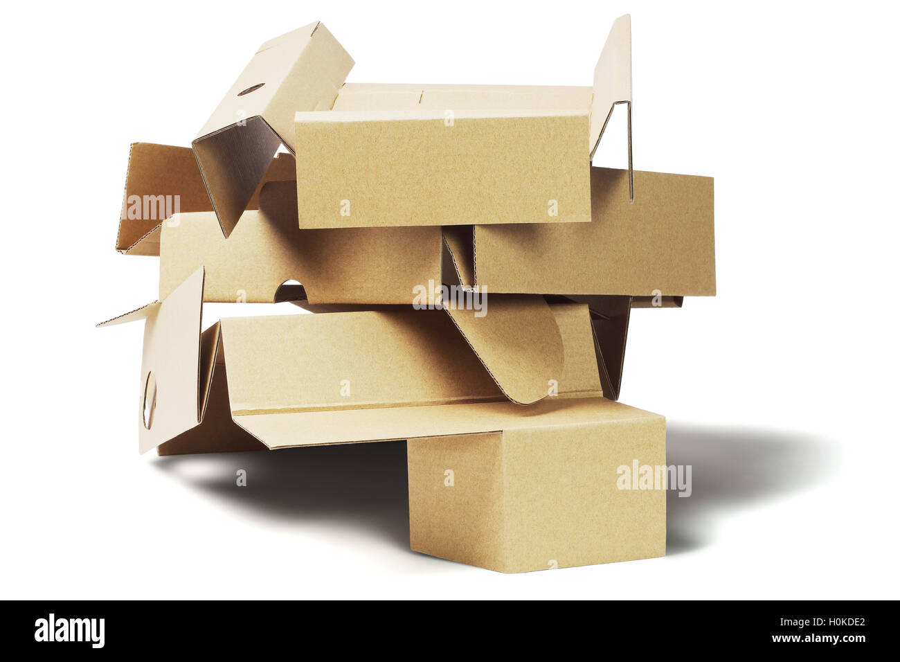 Stack of Packaging Cardboard For Recycling on White Background Stock Photo