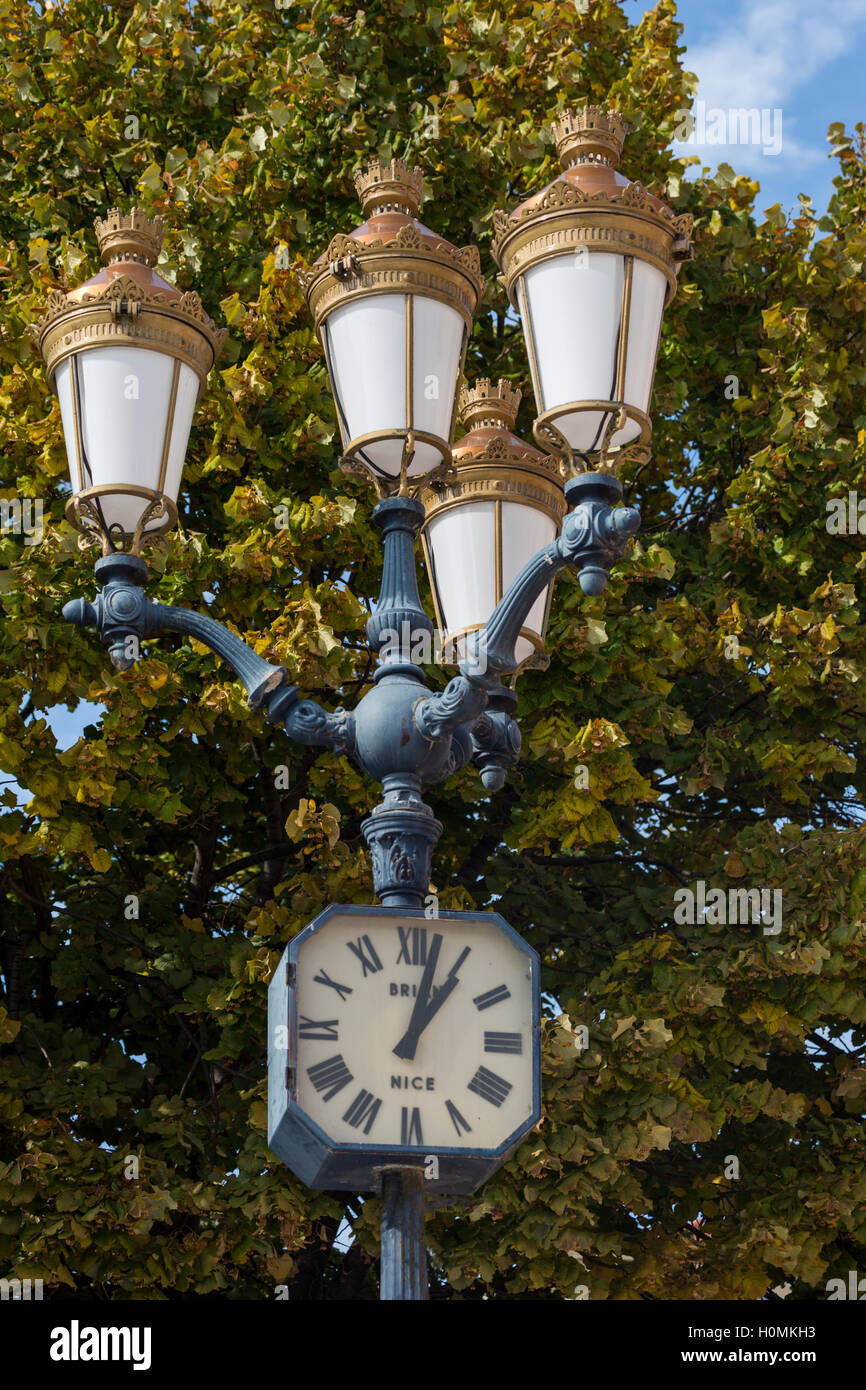 Streetlight and clock, Nice, Alpes-Maritimes,  French Riviera, France Stock Photo