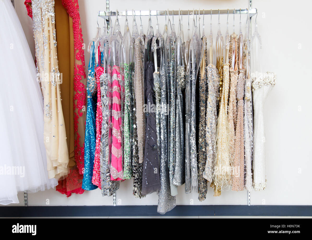 Evening dresses on hangers hi-res stock photography and images - Alamy