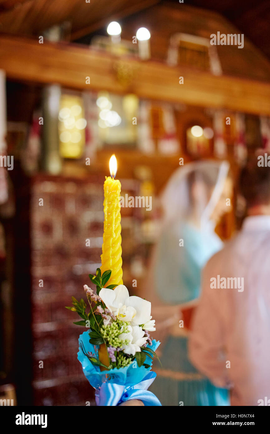Burning candle during wedding ceremony in church Stock Photo Alamy