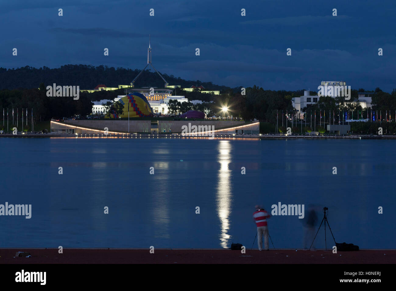 Twilight over Lake Burley Griffin Canberra Australia with the Houses of Parliament in the background. Stock Photo