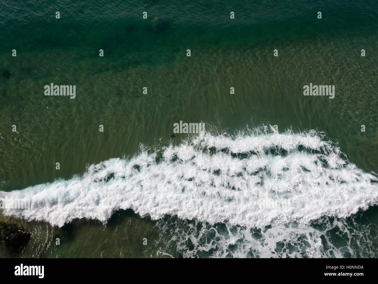 View from above of waves lapping, New South Wales, NSW, Australia Stock Photo