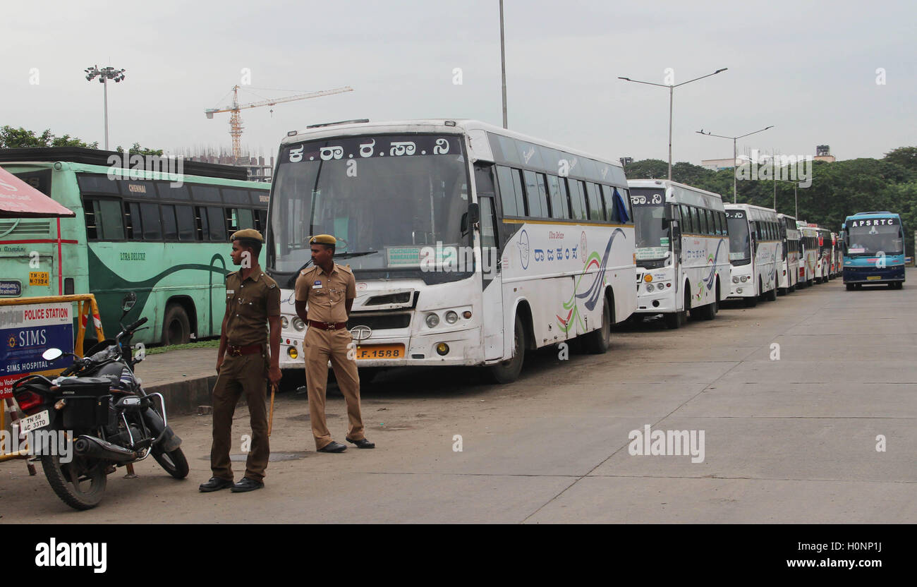 Policemen provide protection to Karnataka buses Chennai, Tamil Nadu, India on September 12, 2016, Stock Photo