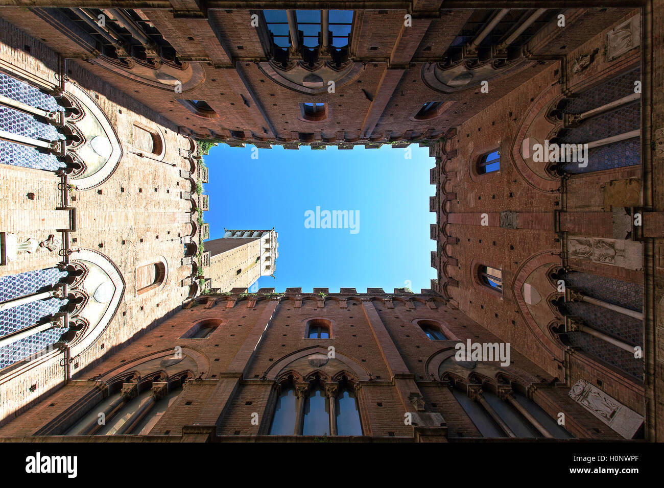 Torre del Mangia seen from courtyard of Palazzo Pubblico, Siena, Province of Siena, Tuscany, Italy Stock Photo