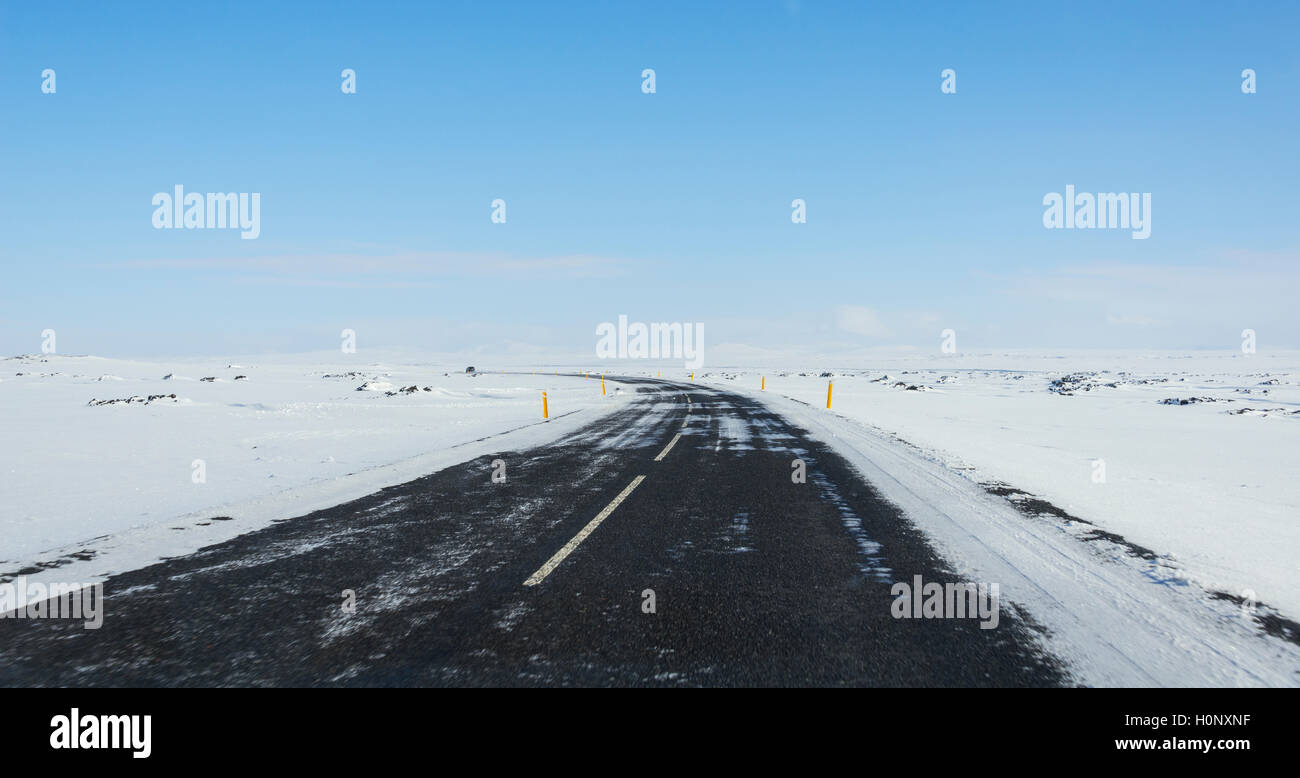 Road through snowy landscape, ring road, National Highway 1 or Hringvegur, North Island, Island Stock Photo