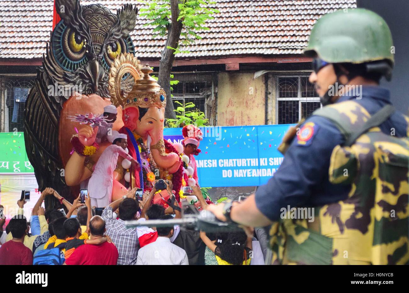 armed Rapid Action Force personnel ensures tight security gigantic idol Hindu god Ganesh led Arabian Sea immersion Mumbai Stock Photo