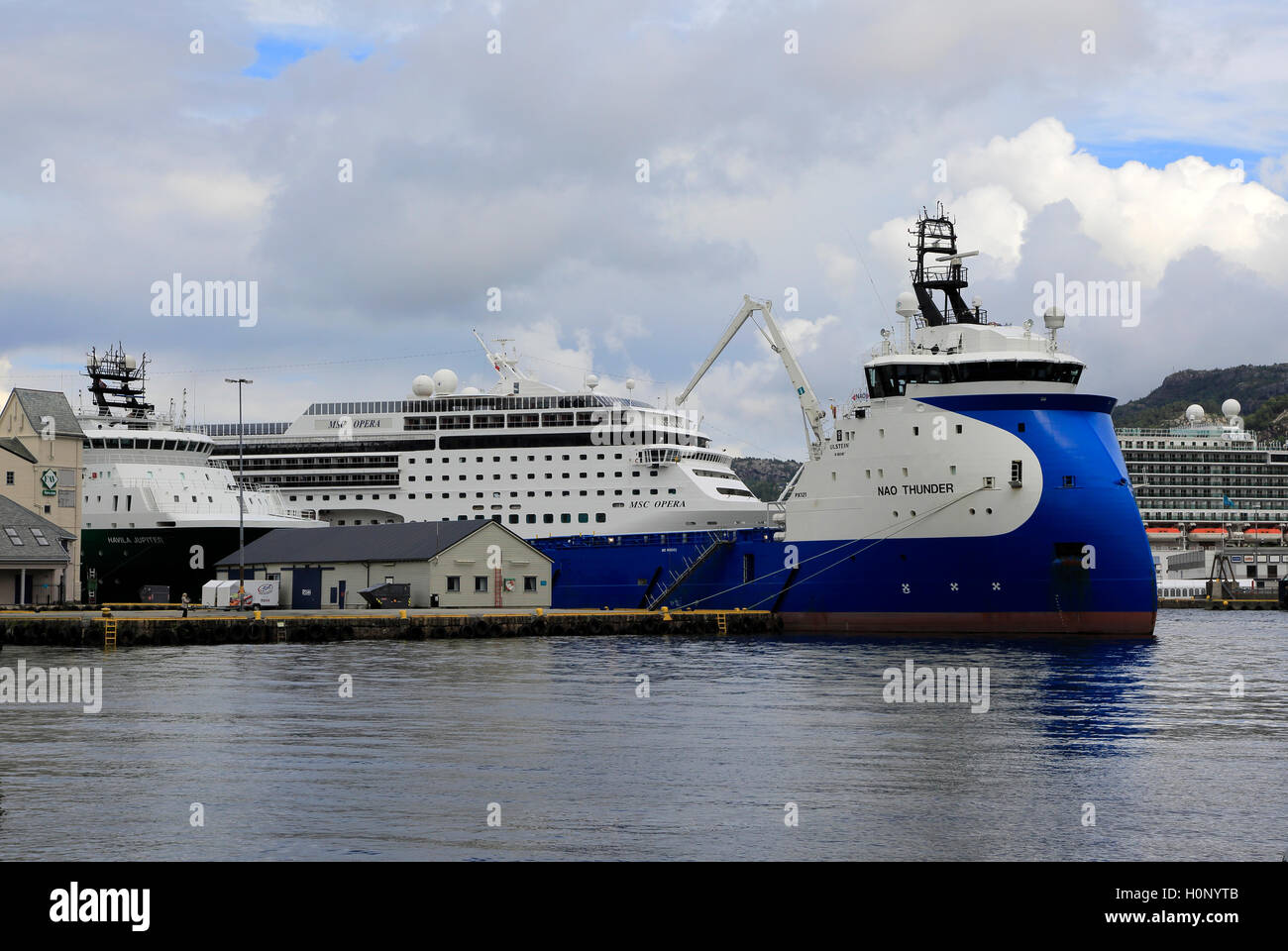 Nao Thunder supply vessel and MSC Opera cruise ship in the harbour, city of Bergen, Norway Stock Photo