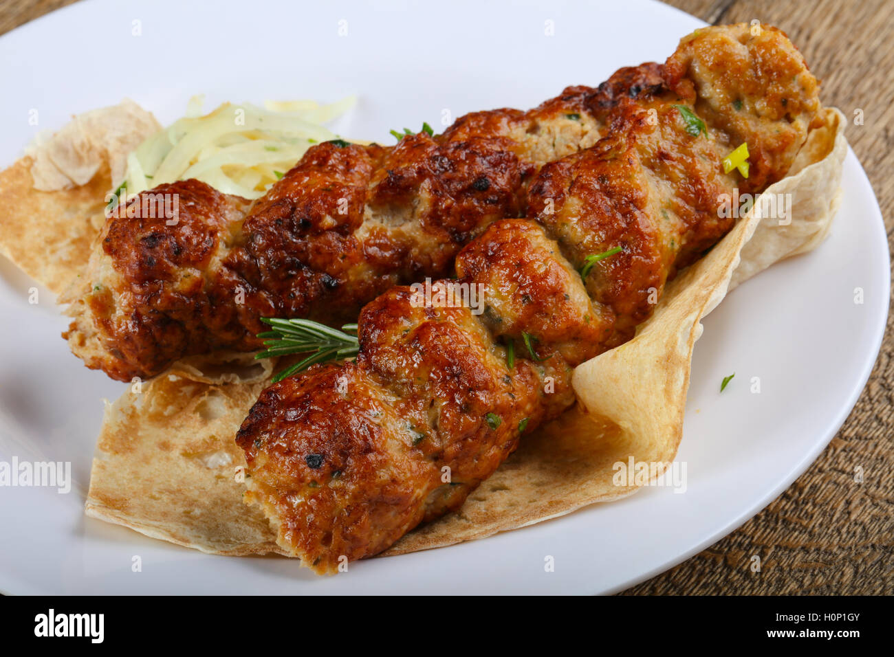 Chicken kebab with onion, parsley and bread Stock Photo Alamy
