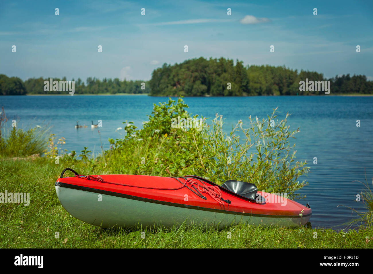 Image of empty canoe by the lake. Helgasjon, Sweden. Stock Photo