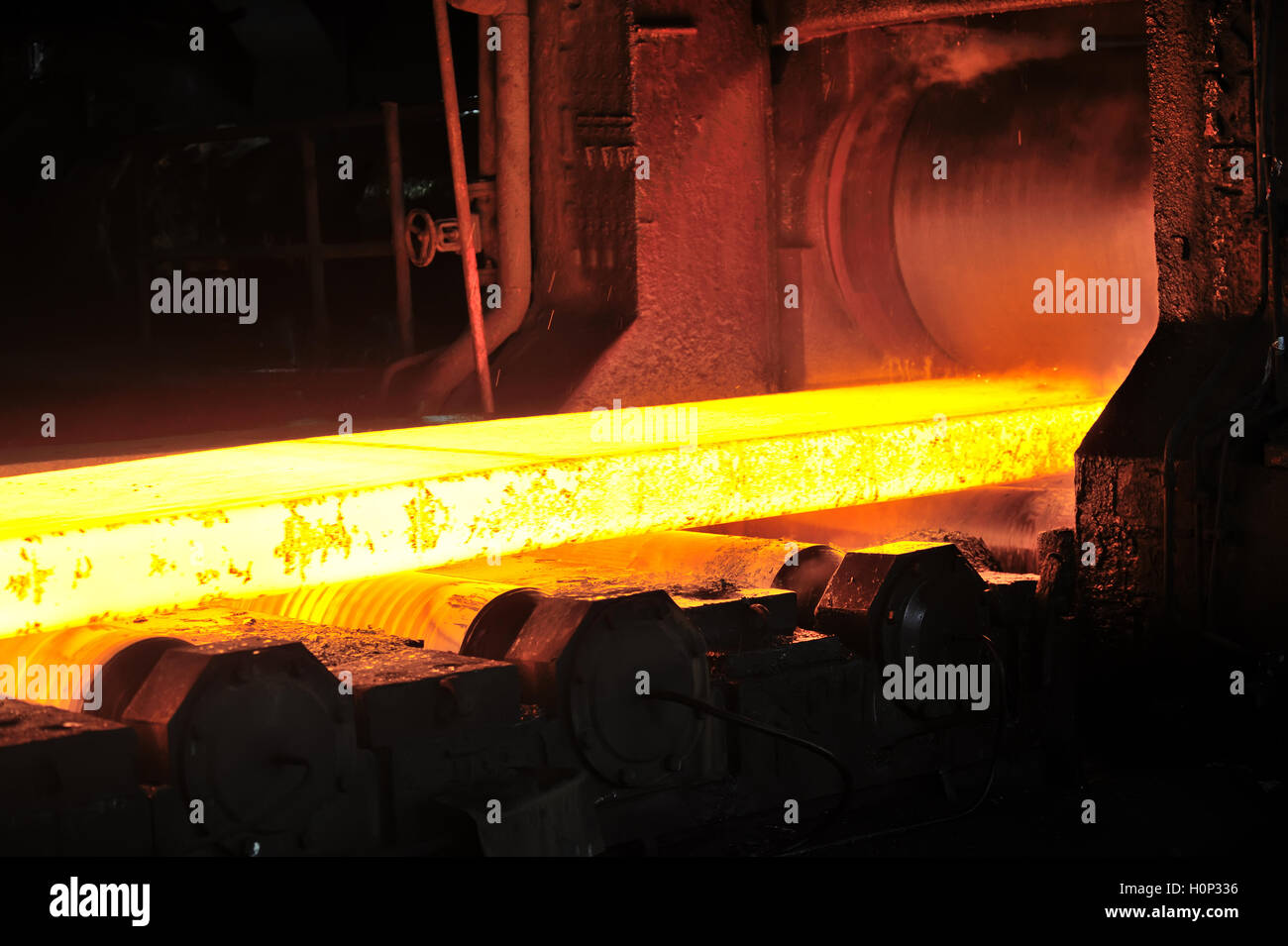 hot steel plate on conveyor in steel plant Stock Photo