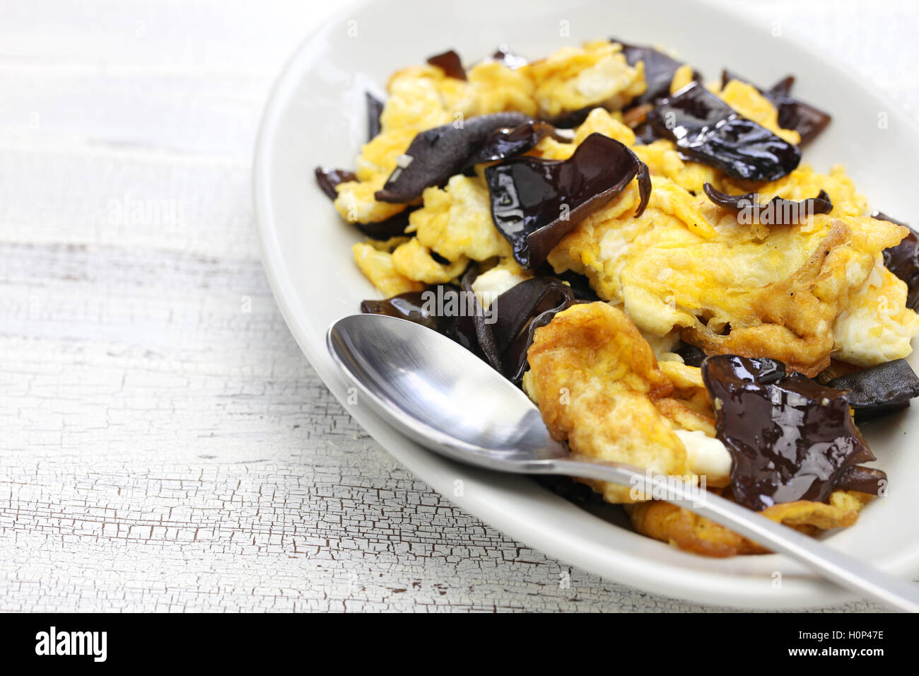 stir fried eggs with wood ear mushrooms, chinese cuisine Stock Photo
