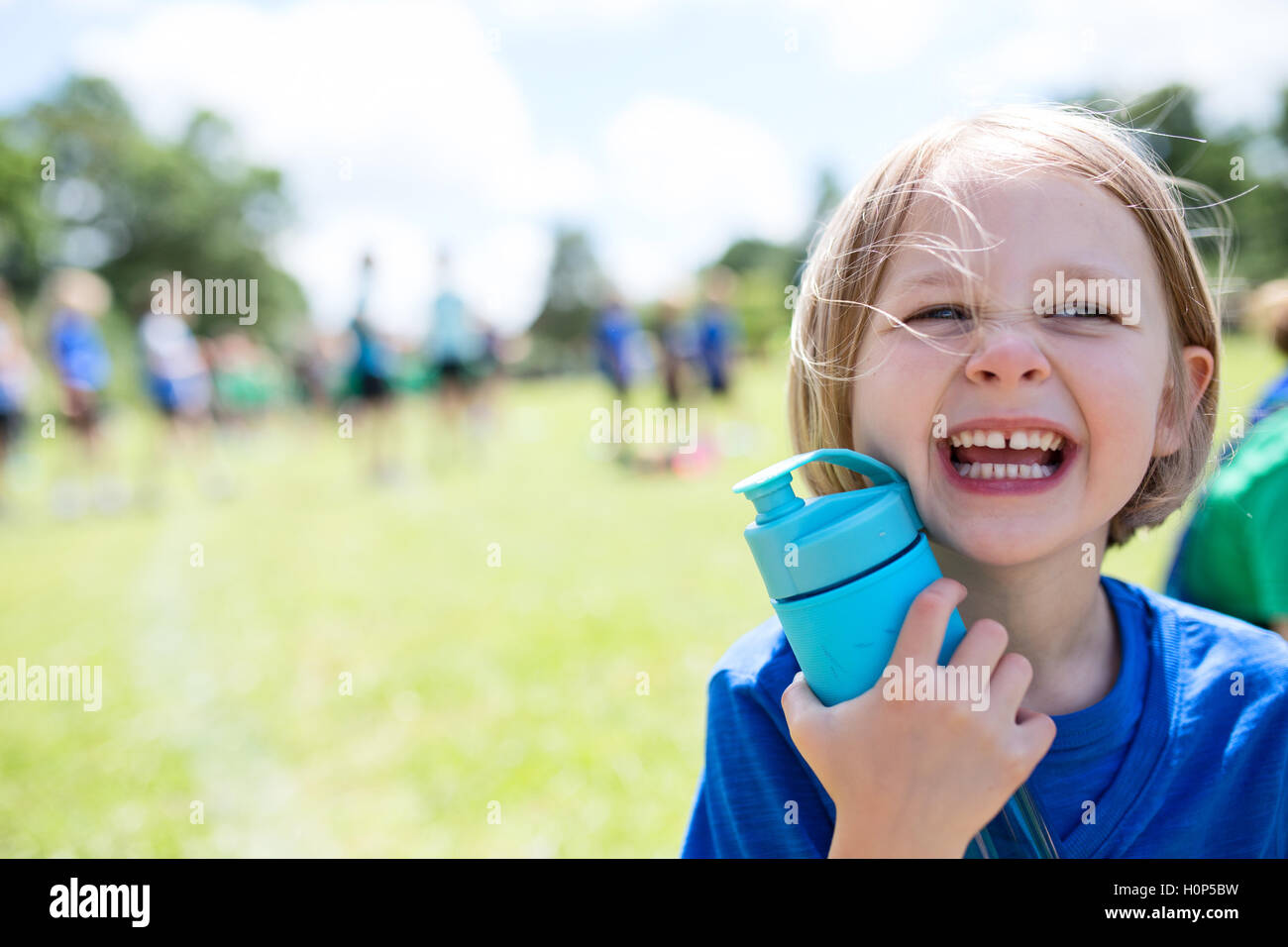 girl shouting with water bottle Stock Photo Alamy