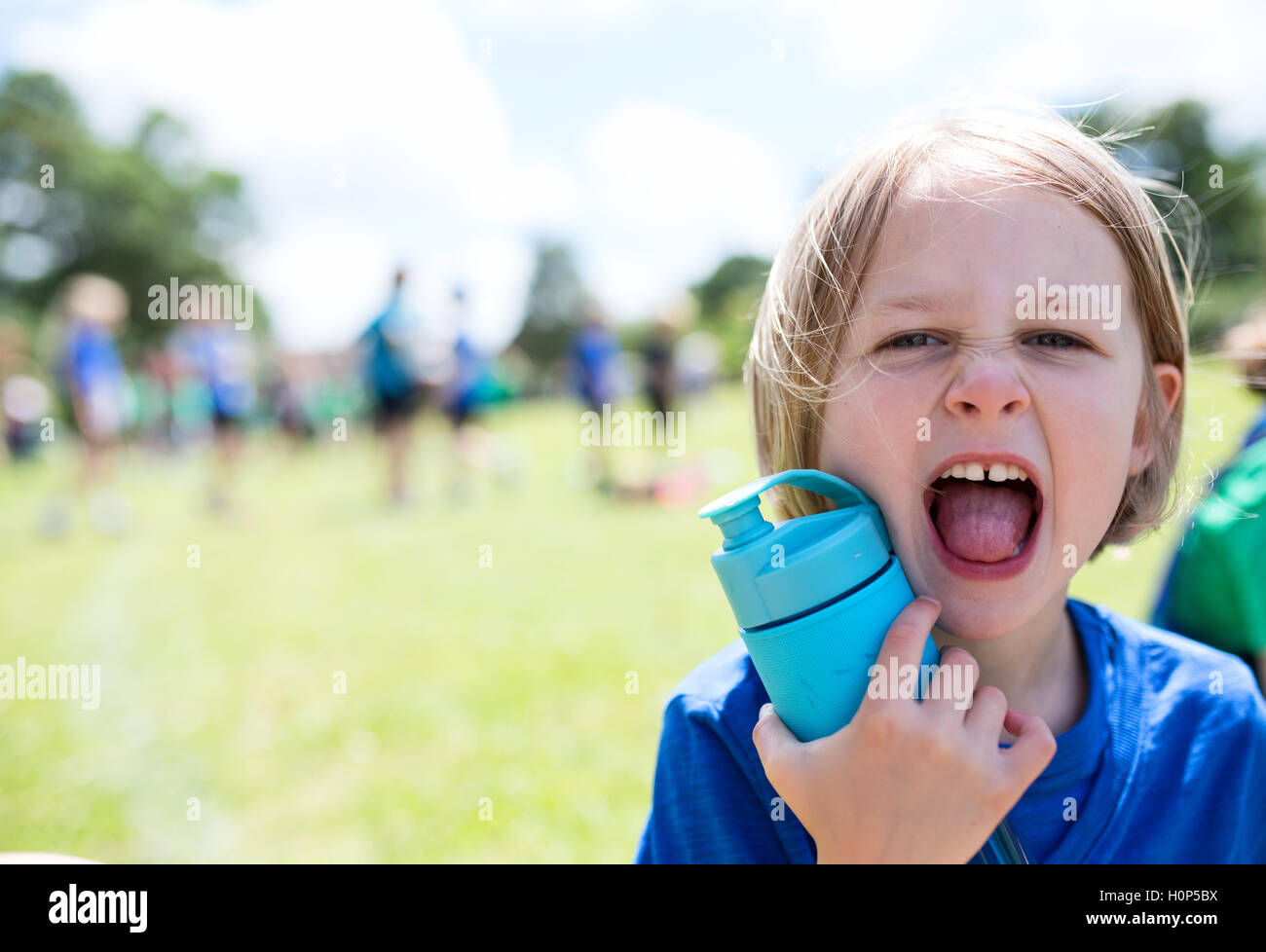 girl shouting with water bottle Stock Photo Alamy