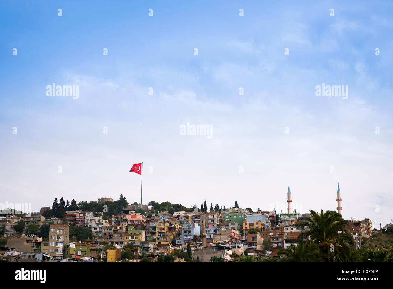 Region of Kadifekale landscape from agora ancient city, Turkish flag and two minarets in the frame. Stock Photo