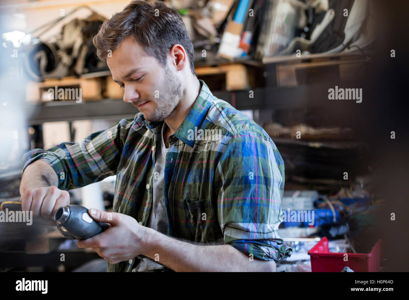 mechanic fixing car part auto repair shop Stock Photo