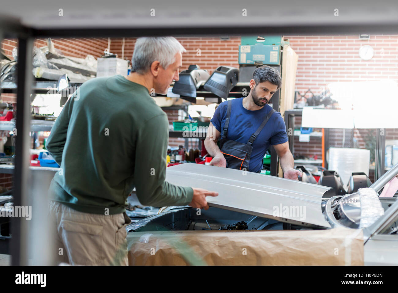 Mechanic lifting hi-res stock photography and images - Alamy