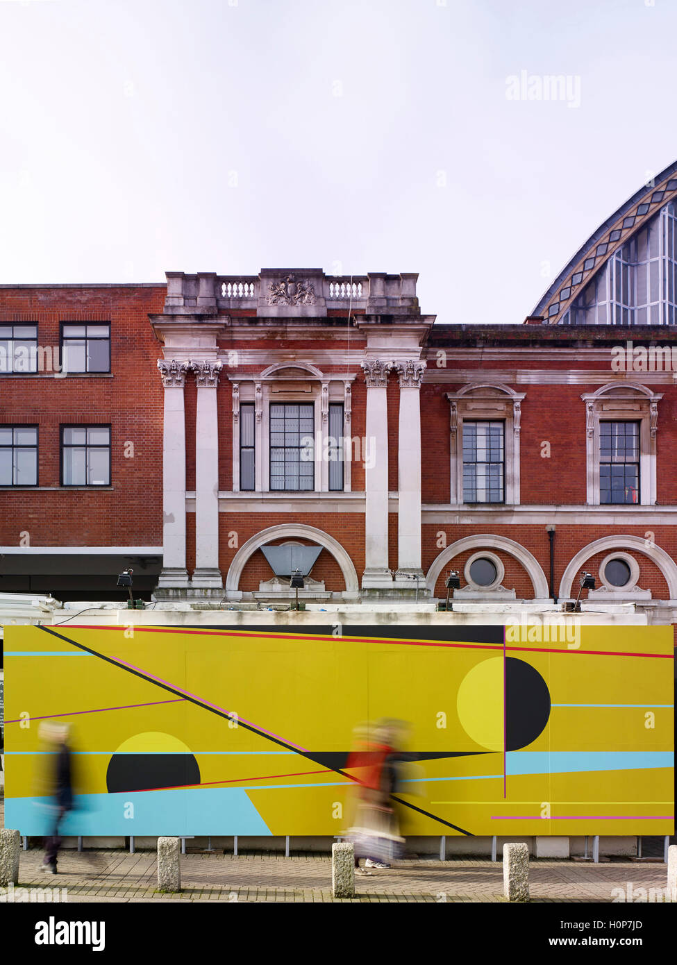 Exterior facade with graphics and figures in motion. Art14 London