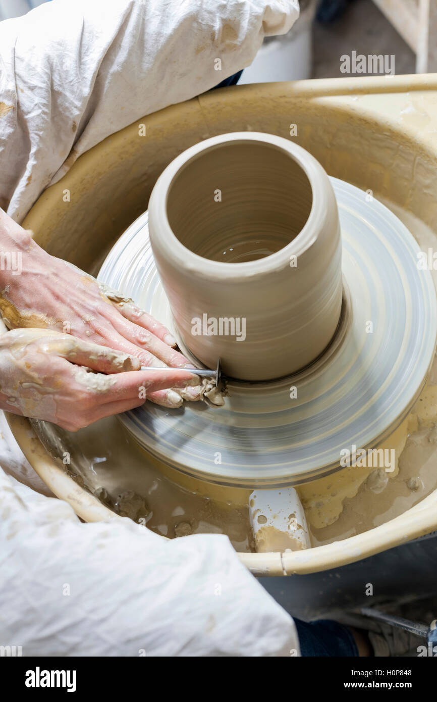 high angle view woman using pottery wheel Stock Photo