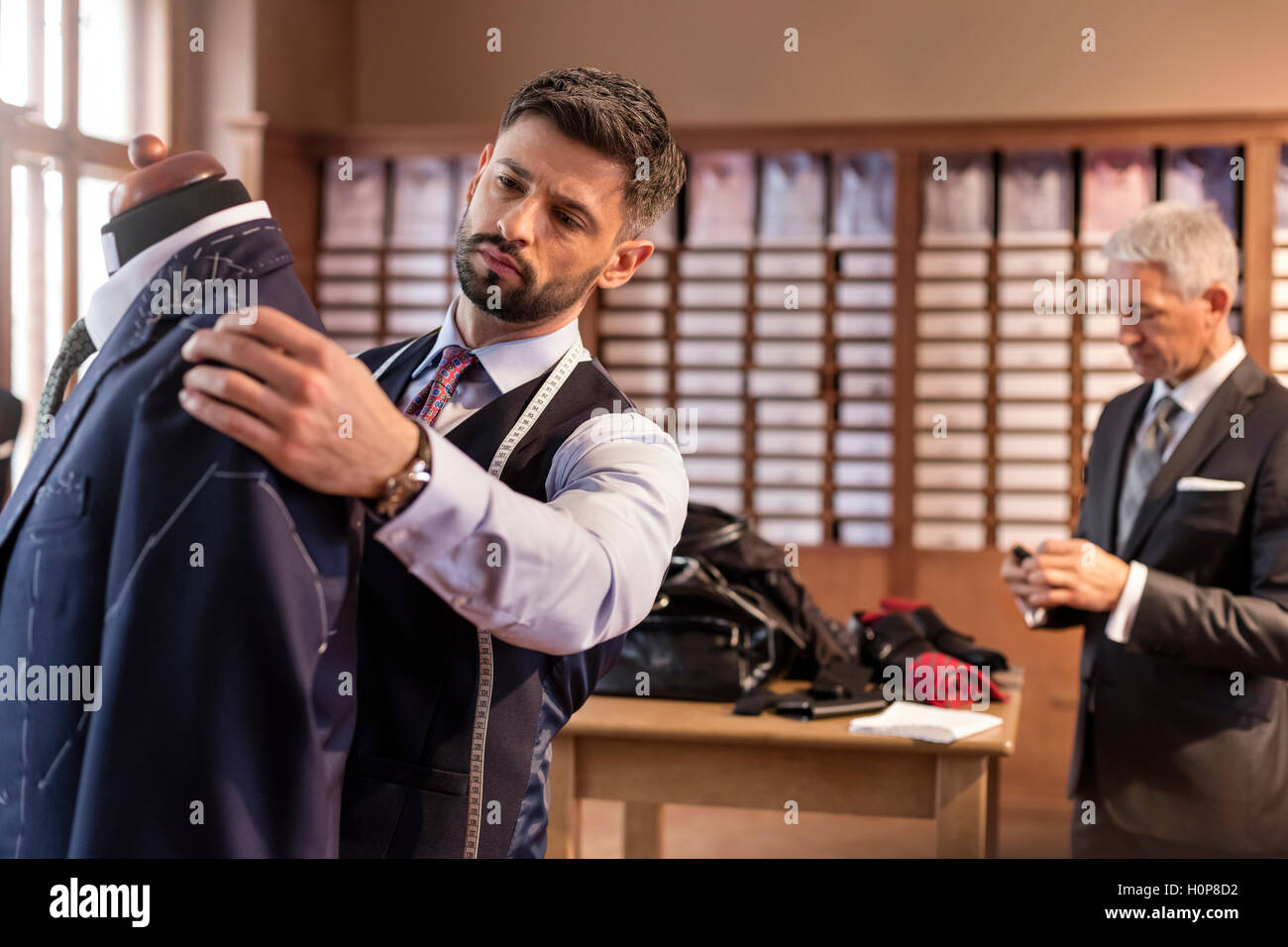 tailor suit dressmakers model menswear shop Stock Photo