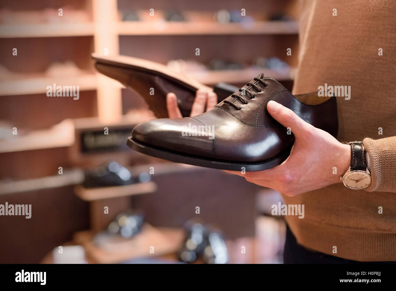 businessman browsing dress shoes menswear shop Stock Photo