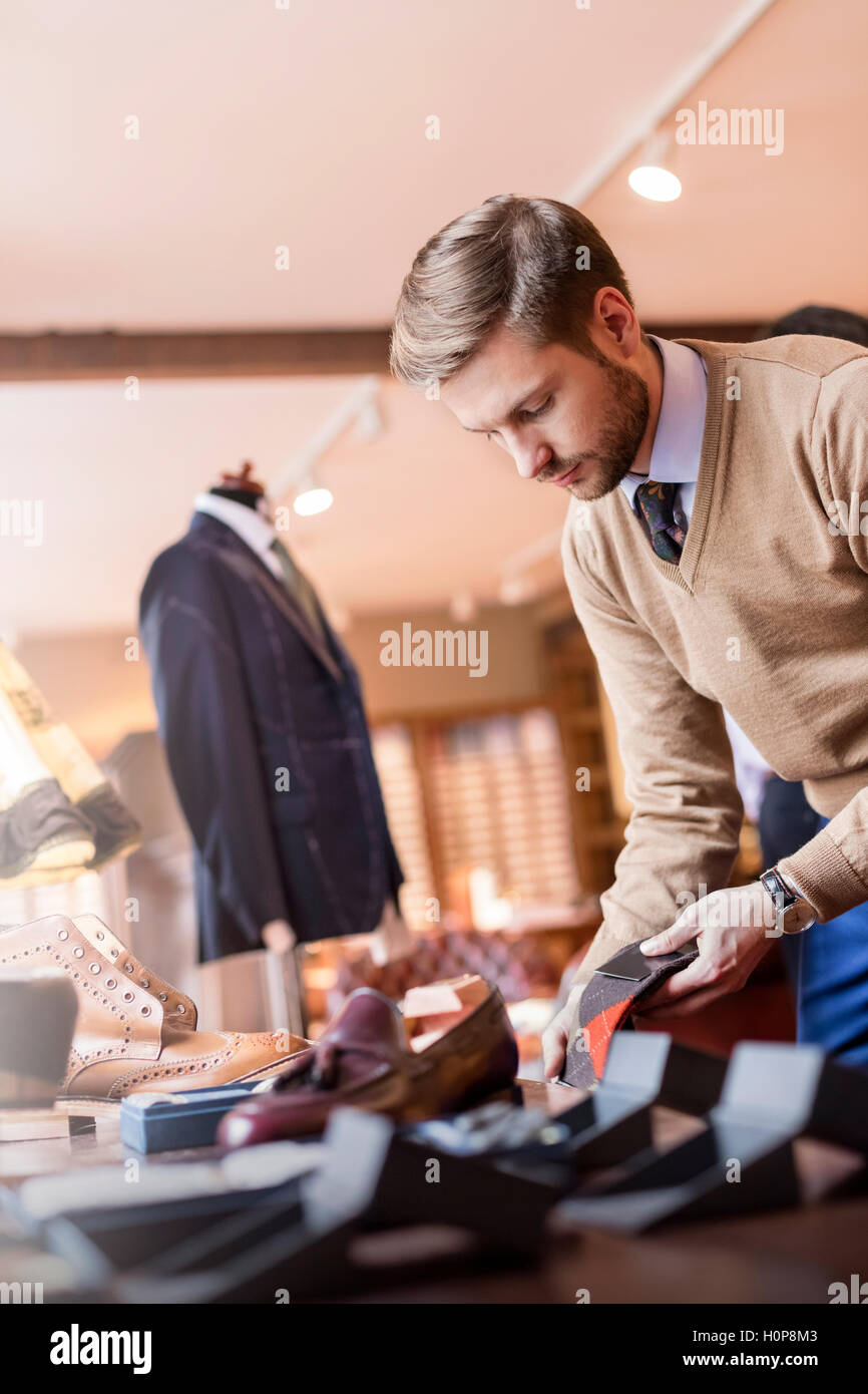 businessman browsing sock menswear shop Stock Photo
