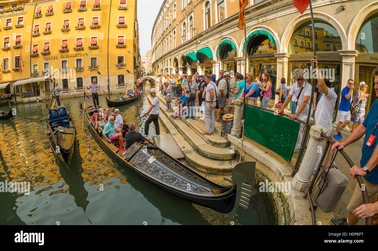 People waiting for a gondola ride in Venice, Italy Stock Photo
