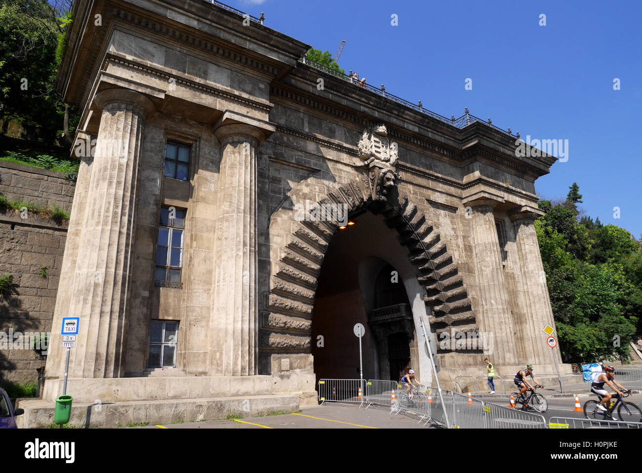 Cyclists coming out of the Castle Hill Tunnel in Clark Adam ter (Square), Budapest, Hungary Stock Photo