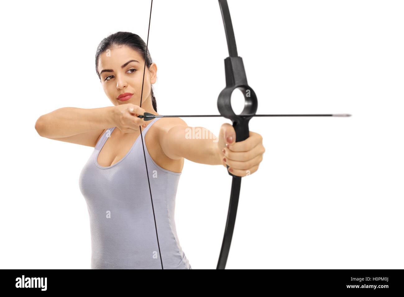 Woman aiming with a bow and arrow isolated on white background Stock Photo