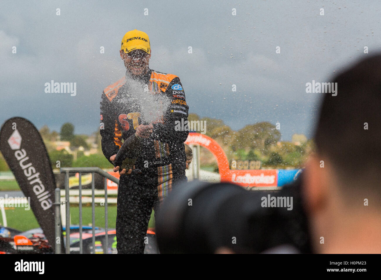 MELBOURNE/AUSTRALIA - SEPTEMBER 17, 2016: Red Bull driver Shane Van Gisbergen spraying champagne after his podium finish at the  Stock Photo