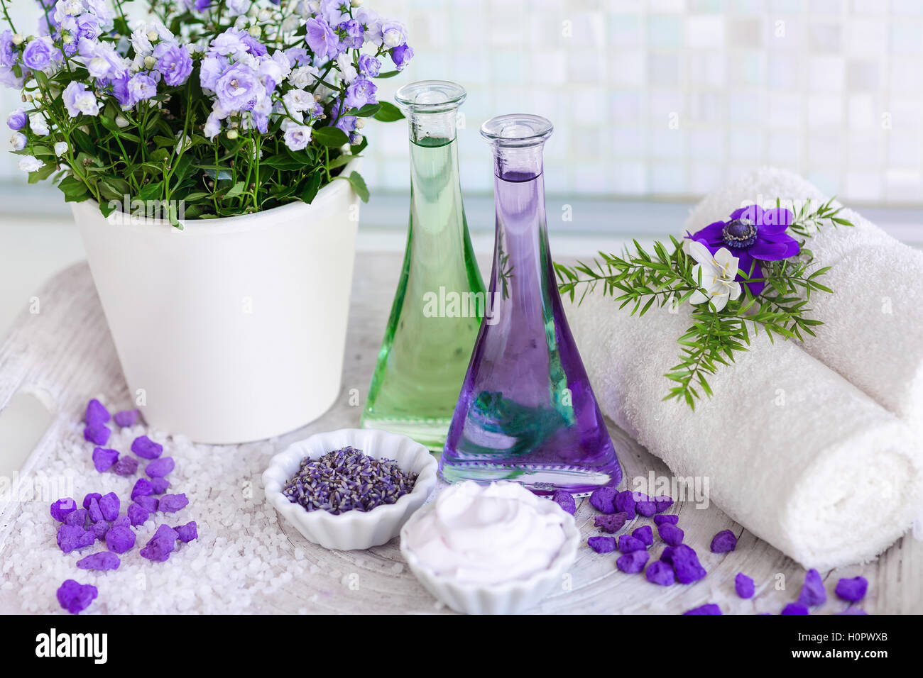 https://c8.alamy.com/comp/H0PWXB/still-life-massage-oil-in-bottles-with-flowers-on-a-tray-towels-and-H0PWXB.jpg