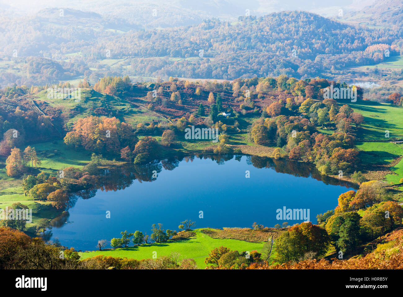 Loughrigg Tarn viewed from Loughrigg Fell in the Lake District National Park. Cumbria. England. Stock Photo