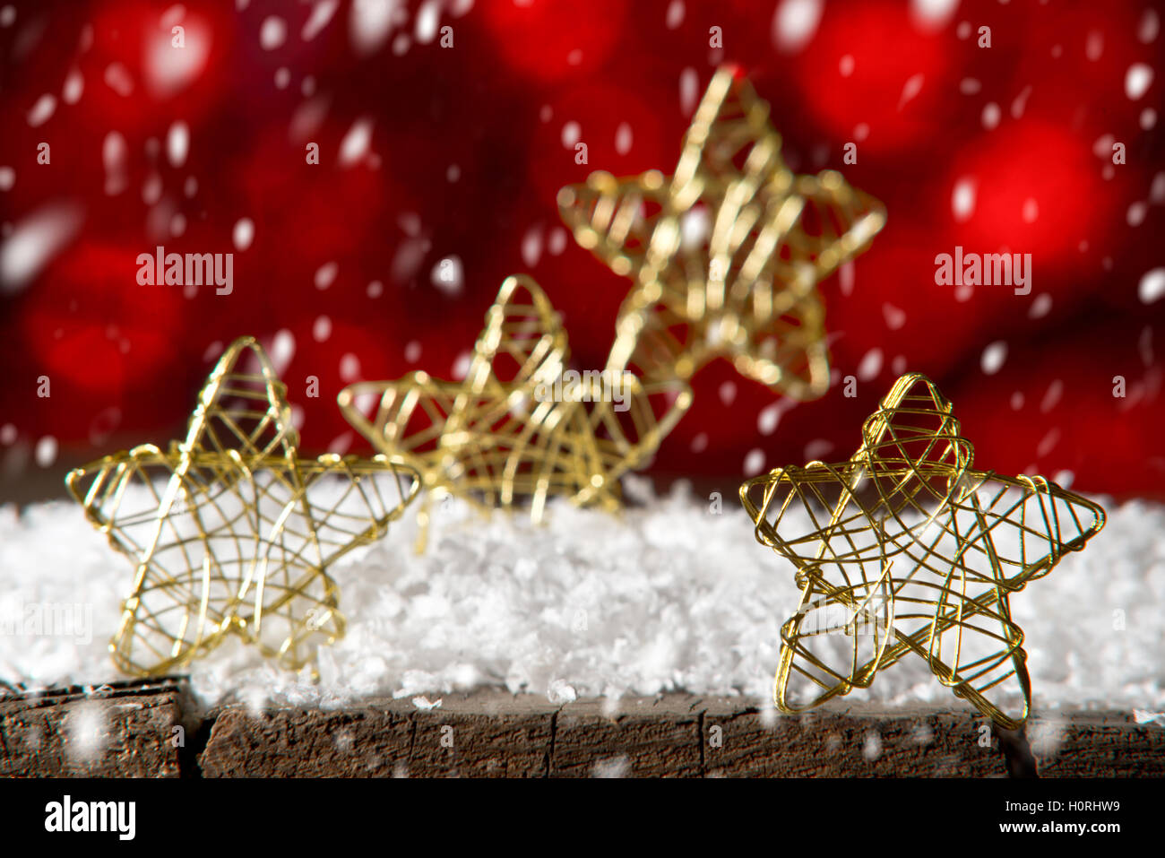 Golden Christmas stars on the red background Stock Photo - Alamy